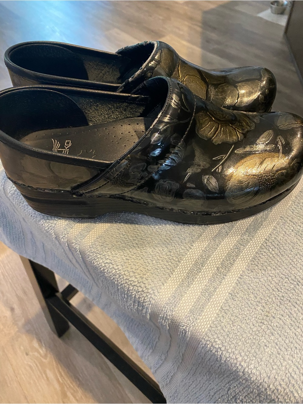 Dansko Black Floral Patent Clogs